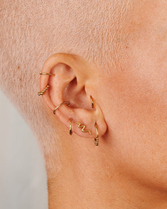 Snake Piercing gold